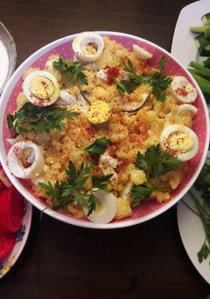 A picture of Boiled Potatoes with Boiled Eggs, Garlic, and Spices.