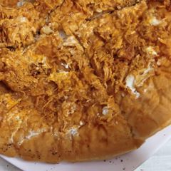 A picture of Tandoori chicken pizza on stove.