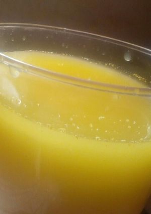 A picture of Turmeric and ginger juice with clove and honey.