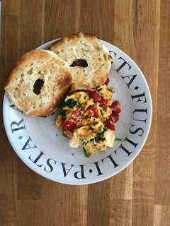 A picture of Simple scrambled eggs with tomato and spinach.