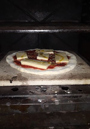 Una foto de Pizza a la piedra