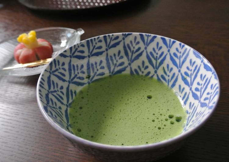 Preparing a cup of Matcha on a table