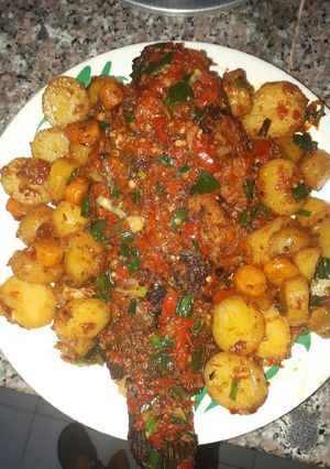 A picture of Fried fish with potatoes.