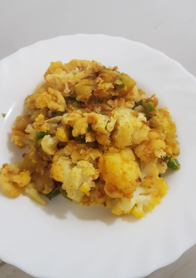 Una foto de Coliflor con patatas al curry