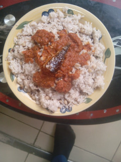 A picture of Rice and beans with stew.