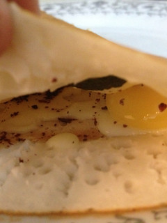 A picture of Eggy cheesy dosa for one.