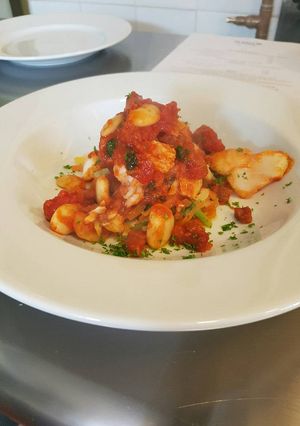 A picture of Cod fillets with chorizo.