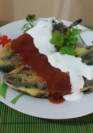 Una foto de Chiles poblanos rellenos de queso