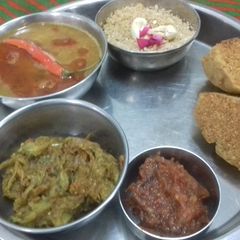 A picture of Daal baafle,churma,tamatar ki chutney and baigan ka bharta.