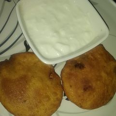 A picture of Dal kachori with curd.