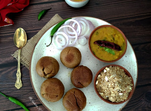 A picture of Rajasthani Dal-stuffed Bati Churma.