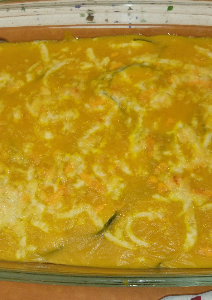 Una foto de Calabacines gratinados con crema de calabaza, curry y queso