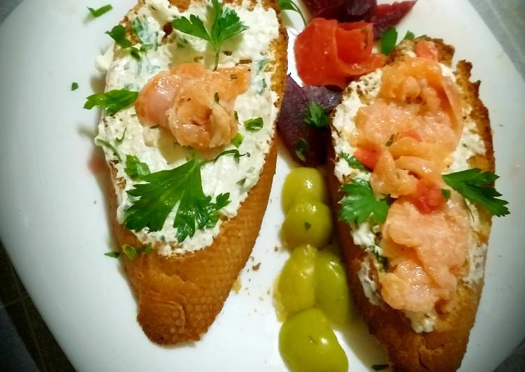 Grilled toast with feta cheese flavored with herbs and salmon