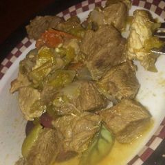 A picture of Pork with green chilli's.