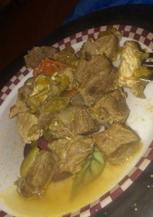 A picture of Pork with green chilli's.