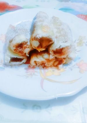 A picture of Delicious tasty banana nutella bread roll.
