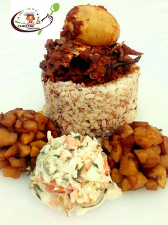 A picture of Ofada rice with stew,dodo and coleslaw.