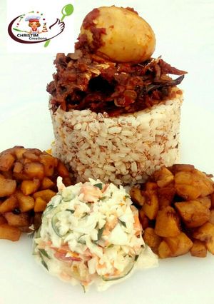 A picture of Ofada rice with stew,dodo and coleslaw.