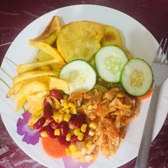 A picture of Irish potato chips 🍟 /fried sweet potatoes & cabbage sauce.