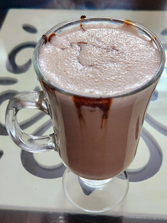A picture of Hershey's chocolate and cocoa milk shake.