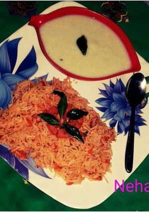 A picture of Tomato rice with bottle gourd raita.