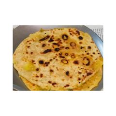A picture of Tasty 😋aloo Paratha from North India 🥔.
