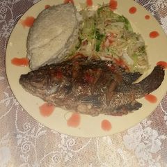 A picture of Garlic wet fried fish and ugali.