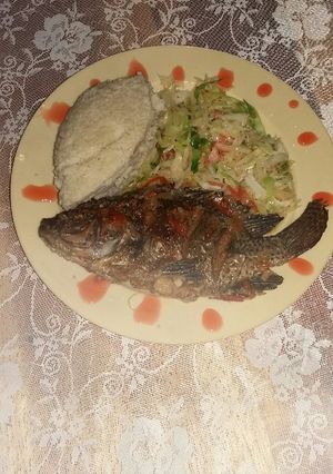 A picture of Garlic wet fried fish and ugali.