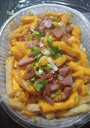 Una foto de Papas Cerveceras (Cheddar, Panceta y Cebolla de verdeo)🍻