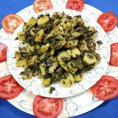 A picture of Aalu methi with dry spices.