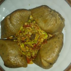 Moimoi with chicken_ cabbage sauce A picture of Moimoi with chicken_ cabbage sauce.