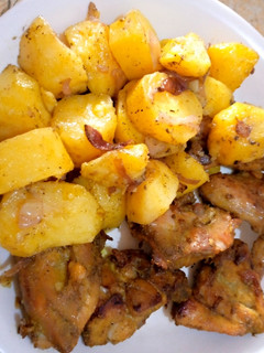 A picture of Oven grilled potatoes and chicken.