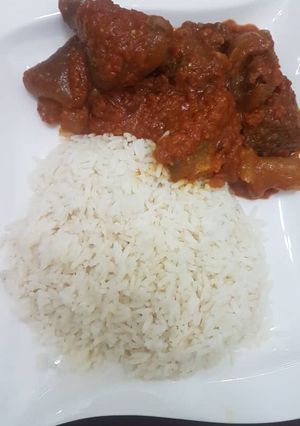 A picture of Beef stew and rice.