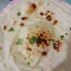 Butter Garlic Naan 🫓 A picture of Butter Garlic Naan 🫓.