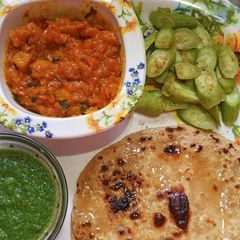 A picture of Mushroom masala with parantha.