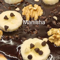 Chocolate walnut banana pizza (loaded with chocolate ganache) kids recipe for christmas party A picture of Chocolate walnut banana pizza (loaded with chocolate ganache) kids recipe for christmas party.