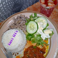 9ja white rice, beans and locust beans sauce (garnished) A picture of 9ja white rice, beans and locust beans sauce (garnished).