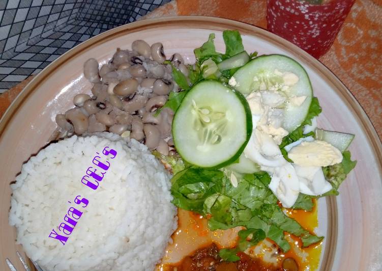 9ja white rice, beans and locust beans sauce (garnished)