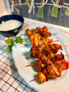 A picture of Marinated Chicken Skewers with Peanut Cream and Spices.