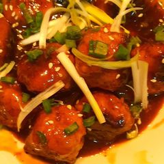 A picture of Chicken meat ball in teriyaki style sauce.