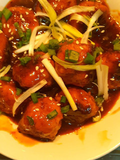 A picture of Chicken meat ball in teriyaki style sauce.