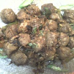 A picture of Soy balls in thick coconut gravy.