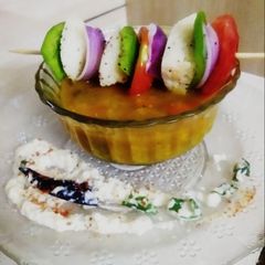 A picture of Idli tikka with sambar dip.
