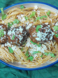 A picture of Spaghetti and chiballs with an Indian twist.