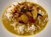 A picture of raw mango in coconut milk