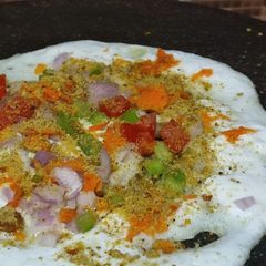 A picture of #TR#Vegetable Uttappam with gunpowder spread side dish narial and onion chutney.