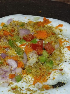 A picture of #TR#Vegetable Uttappam with gunpowder spread side dish narial and onion chutney.