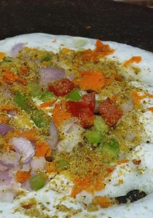 A picture of #TR#Vegetable Uttappam with gunpowder spread side dish narial and onion chutney.