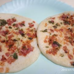 A picture of Onion Tomato Uttapam.