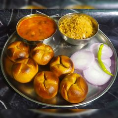 A picture of Dal bati churma.